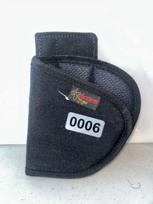 Sale Photo Thumbnail #6: Black nylon belt holster by Acorn featuring stitched edges and a belt loop attachment. Appears to be in good used condition.