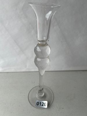 Sale Photo Thumbnail #181: Single tall clear glass candlestick holder featuring a flared top cup, a decorative double-ball baluster stem, and a round solid foot. Shows good clarity with minor wear.