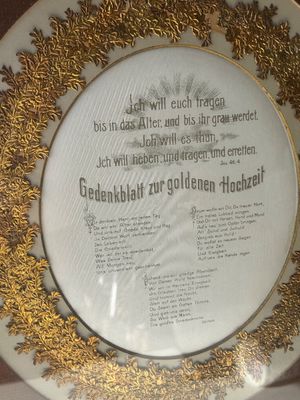 Sale Photo Thumbnail #119: An antique German framed commemorative document ('Gedenkblatt zur goldenen Hochzeit') honoring a golden 50th wedding anniversary. Features German scripture text from Isaiah 46:4 surrounded by an ornate, gilded oak leaf wreath border and mounted within a s
