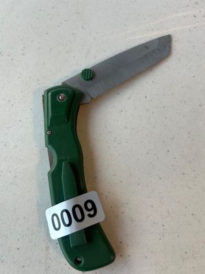 Sale Photo Thumbnail #9: Green composite body folding pocket knife featuring a partially serrated Tanto style blade with a green thumb stud and built-in belt clip. Shows light wear consistent with use.