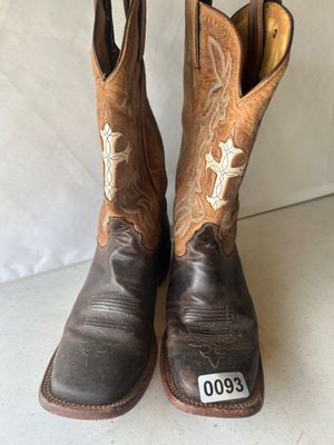 Sale Photo Thumbnail #128: A pair of women's leather Western cowboy boots featuring two-tone brown leather shafts with white cross inlays and decorative embroidery stitching, dark brown leather feet with square toes, and pull straps. Interior stamping indicates style C1002L, size 8