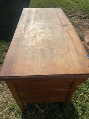 Sale Photo Thumbnail #77: A vintage wooden chest featuring two long drawers with ornate metal brass-tone bail handles, keyhole accents, and French/cabriole style front legs. The surface shows age-appropriate wear, surface scratches, water rings, and finish loss throughout, consist