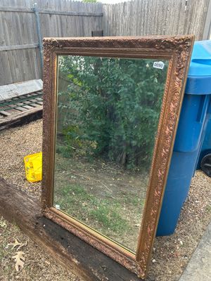 Sale Photo Thumbnail #122: Large vintage wall mirror featuring an ornate, heavily molded composite or wood frame with a gilded bronze/gold-tone finish. Back includes original J.A. Olson Company label marked 'Permaflect Mirror, Winona, Mississippi' with care and hanging instructions