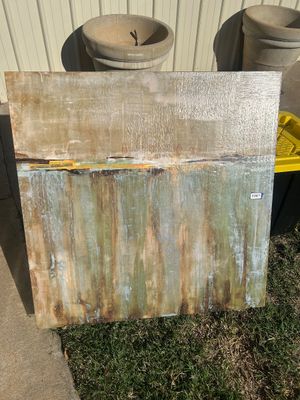 Sale Photo Thumbnail #70: Large square contemporary abstract artwork featuring textured impasto application with earthy tones of sage green, beige, ochre, yellow, and brown, divided horizontally near the upper third. The canvas measures approximately 36 to 40 inches square based o