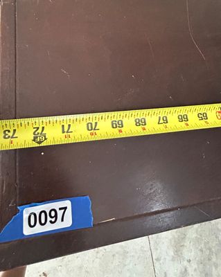 Sale Photo Thumbnail #137: A dark brown wood media console featuring multiple open cubbies and shelves for electronic components and media storage. Tape measure photos show approximate dimensions of 72 inches long, 16 inches deep, and 32 inches high. Shows light surface wear and sc