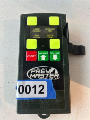 Sale Photo Thumbnail #12: Electronic handheld Johnny Stewart PreyMaster digital caller device featuring sound module slots (currently inserted module features crow calls) and control buttons for on/off and volume adjustment.