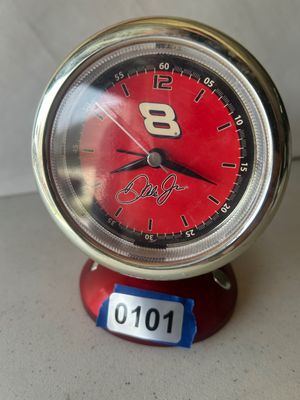 Sale Photo Thumbnail #150: NASCAR themed table or desk clock styled like a tachometer/gauge, featuring Dale Earnhardt Jr.'s #8 logo and printed signature on a red dial face with a chrome-finished bezel.