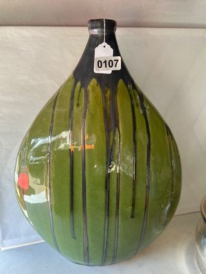 Sale Photo Thumbnail #163: A striking large teardrop-shaped ceramic decorative vase featuring a vibrant olive green glaze with a fine crackle finish, accented by a dark metallic black drip glaze extending from the neck downward in vertical runs. Perfect as a Mid-Century Modern or c