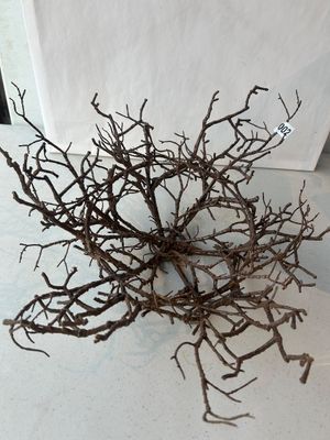 Sale Photo Thumbnail #2: A rustic, hand-crafted decorative bowl or center piece constructed from interwoven natural twigs and small branches. Features a open, organic nest-like design. Marked with lot sticker '002'. Appears in good pre-owned condition.