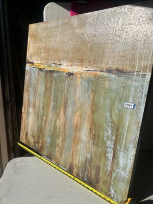 Sale Photo Thumbnail #69: Large square contemporary abstract artwork featuring textured impasto application with earthy tones of sage green, beige, ochre, yellow, and brown, divided horizontally near the upper third. The canvas measures approximately 36 to 40 inches square based o