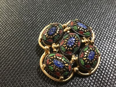 Sale Photo Thumbnail #51: Vintage gold-tone brooch featuring five oval cabochons with colorful floral-style enamel details in blue, green, and red. The back is stamped '(C)SARAH COV' and has a working pin back closure. Shows minor age-appropriate surface wear on the back.