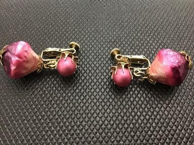 Sale Photo Thumbnail #7: A pair of vintage Vendome clip-on earrings featuring pink/fuchsia foil-wrapped teardrop dangle beads and pink pearlized tops set in gold-tone metal. Marked 'Vendome' on the clip mechanism with screw-back tension adjustments. In good vintage condition with