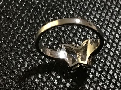 Sale Photo Thumbnail #73: 18 KtGPSilver-tone ring featuring a butterfly motif set with clear faceted stones forming the wings. Measures approximately size 6.5 on a ring mandrel. Shows minor surface wear consistent with light use.