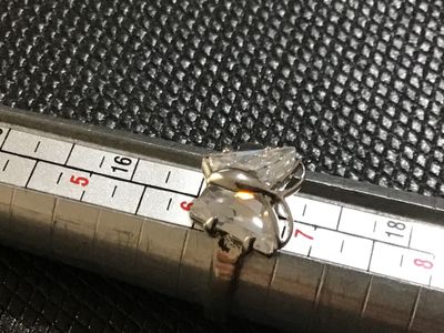 Sale Photo Thumbnail #71: 18 KtGPSilver-tone ring featuring a butterfly motif set with clear faceted stones forming the wings. Measures approximately size 6.5 on a ring mandrel. Shows minor surface wear consistent with light use.