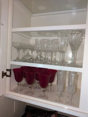 Sale Photo Thumbnail #36: various vintage crystal stemware and ruby red glass goblets.