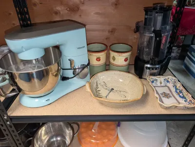 Sale Photo Thumbnail #50: kitchen items including a light blue Howork stand mixer, black food processor, decorative dragonfly bowl, and canisters.