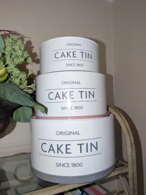 Sale Photo Thumbnail #40: Set of three white vintage-style round metal cake tins 