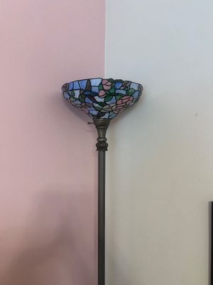 Sale Photo Thumbnail #26: Tiffany-style stained glass torchiere floor lamp featuring a floral and hummingbird motif on a dark bronze metal pole.