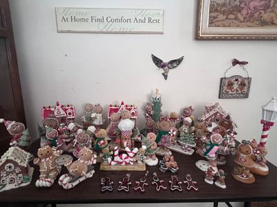 Sale Photo Thumbnail #10: Collection of holiday gingerbread man figurines, gingerbread houses, ornaments, and decor items.
