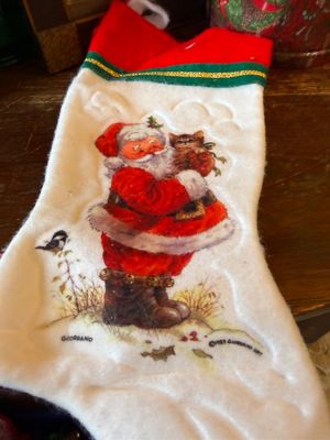 Sale Photo Thumbnail #134: Vintage 1983 Giordano Art plush Christmas stocking featuring an illustration of Santa Claus holding a kitten.