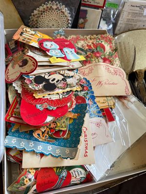 Sale Photo Thumbnail #75: Collection of vintage die-cut Valentine's Day and Christmas cards, featuring various heart shapes, floral accents, and character illustrations.