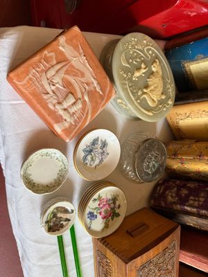 Sale Photo Thumbnail #11: Collection of vintage decorative trinket boxes, carved stone alabaster containers, miniature porcelain butter butter butter dishes, and a carved wooden box.
