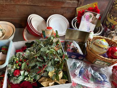 Sale Photo Thumbnail #123: Collection of vintage Christmas decor, featuring artificial greenery garlands, hand-painted and glass ornaments, red velvet bows, and nesting mixing bowls.