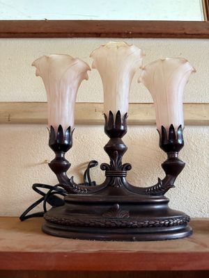 Sale Photo Thumbnail #8: Vintage three-light candelabra lamp with a dark bronze-tone metal base and frosted pink tulip-shaped glass shades.