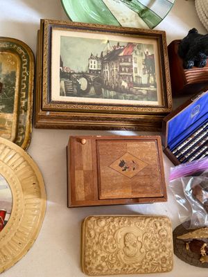 Sale Photo Thumbnail #18: Collection of vintage decorative trinkets, including a framed European landscape art print, a Scottie dog inlaid wooden box, and a carved cameo celluoid trinket box.