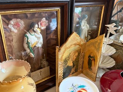 Sale Photo Thumbnail #17: Pair of vintage framed 3D religious shadow boxes featuring Saint Joseph and the Virgin Mary, alongside a folding gilded triptych icon and milk glass decor.