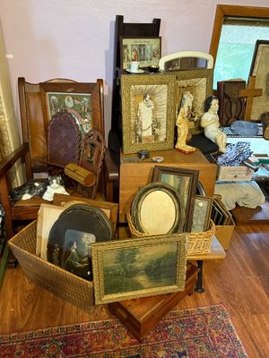 Sale Photo Thumbnail #91: Collection of vintage religious art, framed prints, shadow boxes with statues, a ceramic cat figurine, and wooden furniture items.