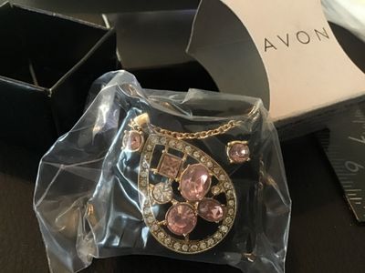 Sale Photo Thumbnail #16: Avon "Luminous Veil" necklace and matching earring gift set in color/style "Vintage rose". Features pink rhinestones set in a gold-tone teardrop pendant with matching stud earrings. Items appear new in original plastic packaging with box.