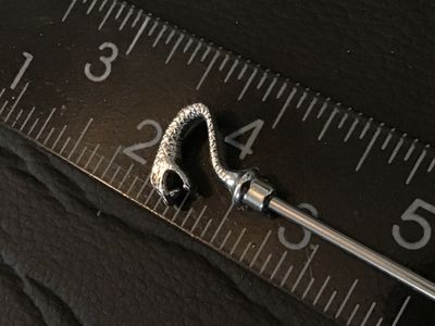 Sale Photo Thumbnail #50: Silver-tone metal stick pin featuring a detailed cobra / snake head top design. Total length measures approximately 3.75 inches long. Good condition with minimal wear.