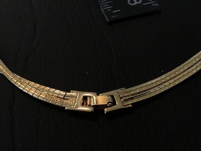 Sale Photo Thumbnail #47: A vintage gold-tone double strand flexible omega chain choker necklace featuring a fold-over clasp closure. Measures approximately 15-16 inches in total length. Good vintage condition with light pre-owned wear and intact finish.