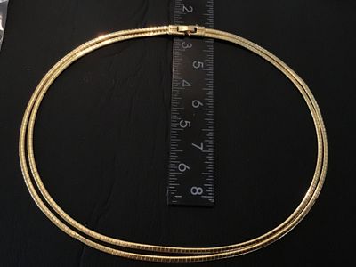Sale Photo Thumbnail #45: A vintage gold-tone double strand flexible omega chain choker necklace featuring a fold-over clasp closure. Measures approximately 15-16 inches in total length. Good vintage condition with light pre-owned wear and intact finish.