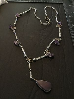 Sale Photo Thumbnail #52: Artisan handmade wire-wrapped necklace featuring purple amethyst chip accents, clear tube beads, silver-tone wire scroll motifs, and a central teardrop agate or amethyst cabochon pendant. Finished with an S-hook clasp. Measures approximately 16-18 inches 