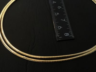 Sale Photo Thumbnail #46: A vintage gold-tone double strand flexible omega chain choker necklace featuring a fold-over clasp closure. Measures approximately 15-16 inches in total length. Good vintage condition with light pre-owned wear and intact finish.