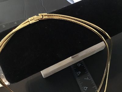Sale Photo Thumbnail #48: A vintage gold-tone double strand flexible omega chain choker necklace featuring a fold-over clasp closure. Measures approximately 15-16 inches in total length. Good vintage condition with light pre-owned wear and intact finish.