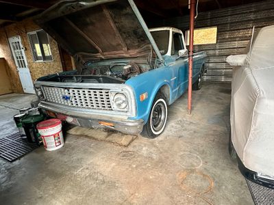 Sale Photo Thumbnail #9: Vintage 1971–1972 Chevrolet C10 pickup truck in light blue with open hood, stored in a garage.