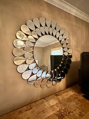 Sale Photo Thumbnail #11: Contemporary round wall mirror featuring a sunburst frame composed of layered teardrop-shaped mirror tiles.