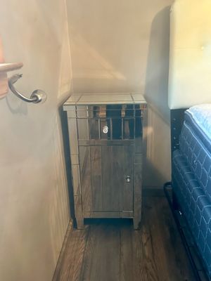 Sale Photo Thumbnail #10: Hollywood Regency style mirrored nightstand featuring one top drawer with a crystal knob and a lower cabinet door with silver hardware.