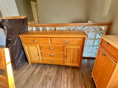 Sale Photo Thumbnail #27: Contemporary light oak buffet server featuring multiple drawers with metal cup pulls and side cabinet doors.