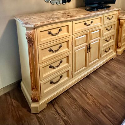 Sale Photo Thumbnail #6: Traditional blonde wood credenza or dresser featuring a faux marble top, ornate carved corner pilasters, and decorative brass hardware.