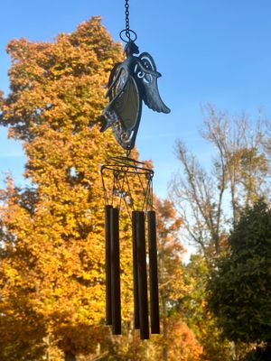 Sale Photo Thumbnail #42: Hanging metal wind chime featuring an angel figure top ornament with metal chime tubes.
