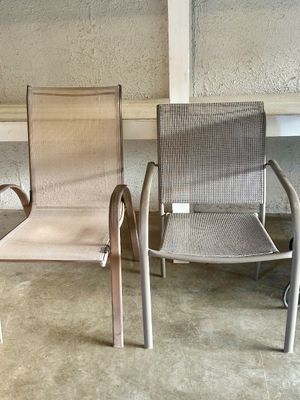 Sale Photo Thumbnail #35: Two metal outdoor sling armchairs with mesh fabric seats and backs.