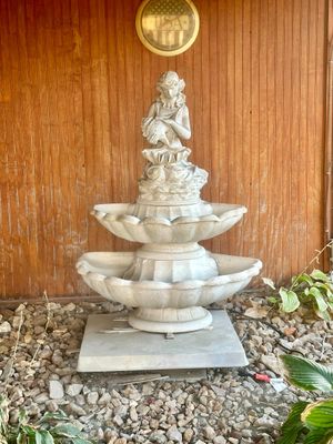 Sale Photo Thumbnail #44: Two-tier concrete outdoor water fountain topped with a statuette of a woman holding a large seashell.