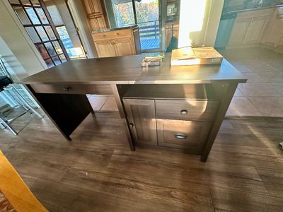Sale Photo Thumbnail #25: Contemporary dark brown laminate executive desk featuring a keyboard tray, side cabinet, and two storage drawers with metal hardware.
