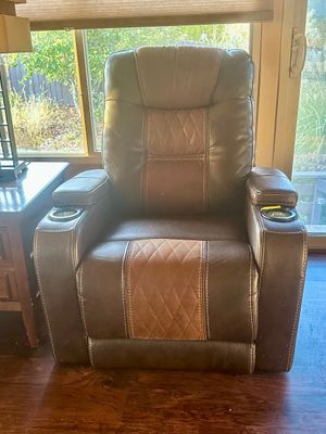Sale Photo Thumbnail #20: Modern power reclining theater armchair in two-tone brown faux leather with diamond quilted center panel accents and integrated armrest cup holders.