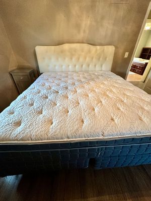 Sale Photo Thumbnail #7: Tufted cream-colored upholstered headboard paired with a modern king-size Tencel mattress and dark grey box springs.