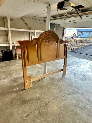 Sale Photo Thumbnail #33: Vintage light-stained wood headboard featuring an arched top frame and carved shell accent detail.